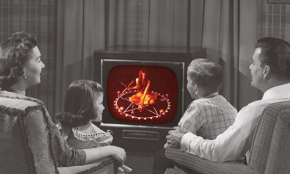Family watching TV in a home