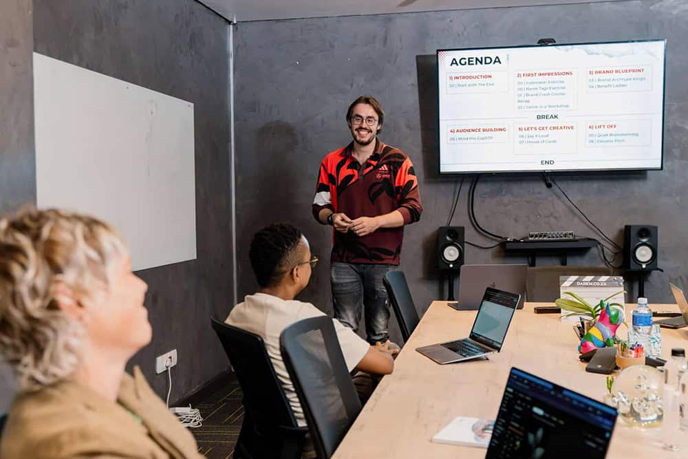 Xavier in a meeting with Kopano and Kim at the DarkMatter offices